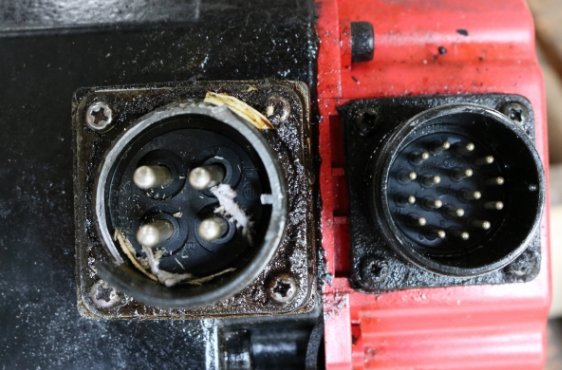 Failed servo motor power connector that was replaced during the repair process