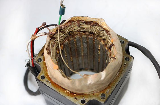 Failed stator windings that were replaced as part of the servo motor repair process